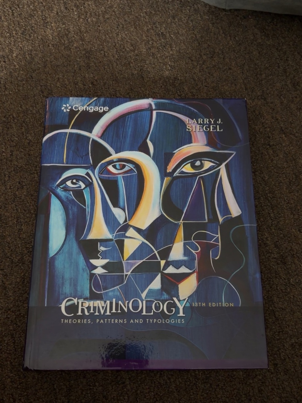 Criminology Textbook by Cengage - Blue Abstract Cover